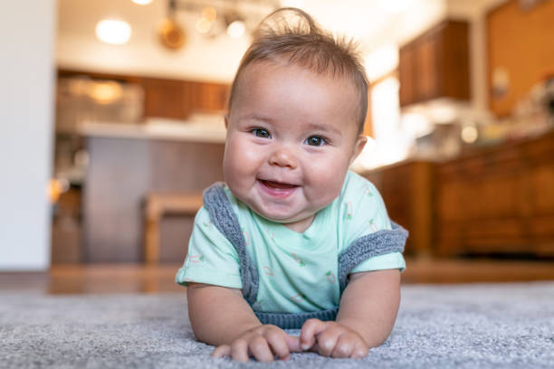 Baby lying on carpet floor | Warnike Carpet & Tile